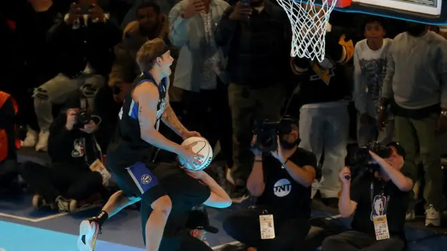 Feb 17, 2024; Indianapolis, IN, USA; Osceola Magic guard Mac McClung (0) competes in the AT&T Slam Dunk Contest during NBA All Star Saturday Night at Lucas Oil Stadium. Mandatory Credit [[[REUTERS VOCENTO]]]