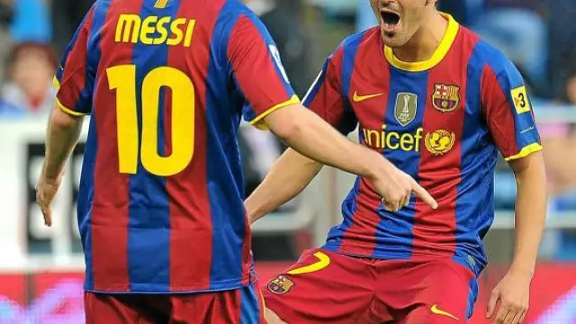 Messi celebra con Villa uno de los dos goles que marcó el pasado sábado en La Romareda.