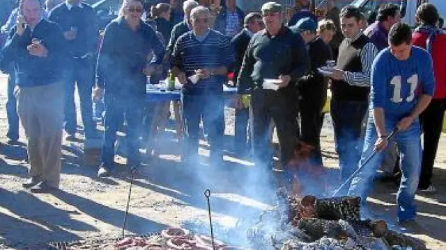 Hoguera de la Feria de San Martín para preparar la carne.