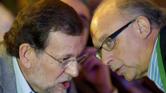 Rajoy y Montoro durante la convención autonómica del PP en Málaga.