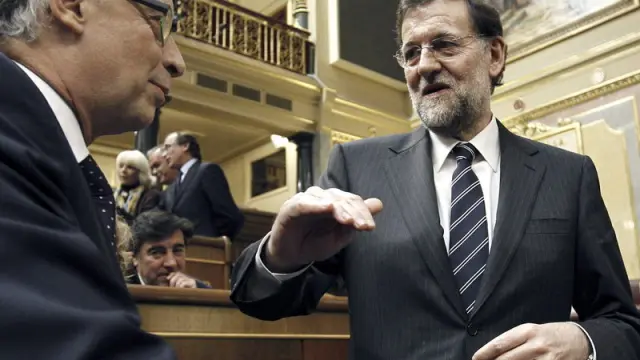 Rajoy y Montoro, durante la sesión en el Congreso