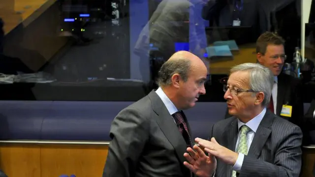 Luis de Guindos y Jean-Claude Juncker