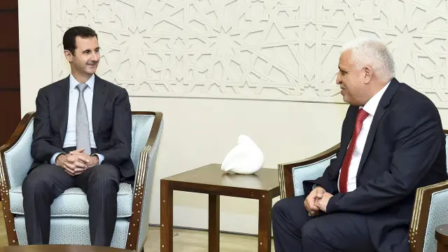 Al Asad junto al Consejero de Seguridad iraquí
