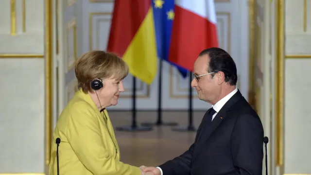 Merkel y Hollande, en la cumbre de París