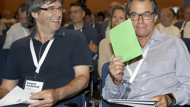 Puigdemont y Mas, durante la votación para cambiar de nombre a CDC.