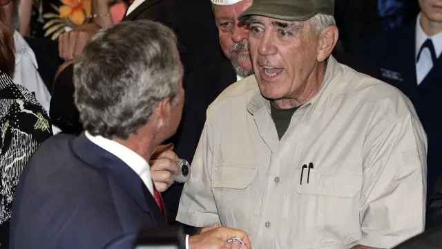 El actor, en un encuentro con el expresidente George Bush.