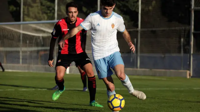 Una acción del partido entre el Real Zaragoza Juvenil A contra el Reus.