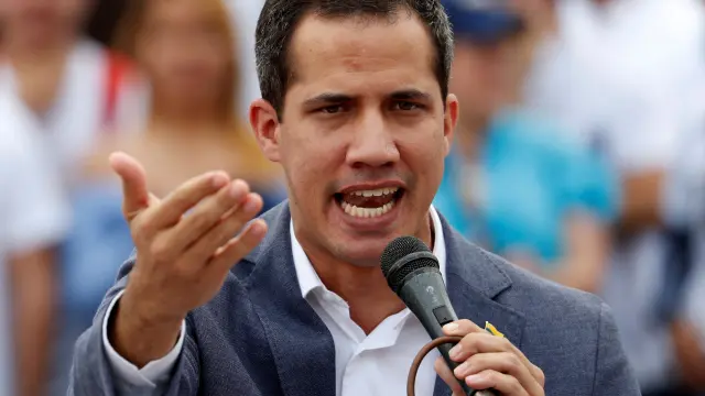 FILE PHOTO: Venezuelan opposition leader Juan Guaido, who many nations have recognised as the country's rightful interim ruler, speaks during a swearing-in ceremony for supporters in Caracas, Venezuela April 27, 2019. REUTERS/Carlos Garcia Rawlins/File Photo [[[REUTERS VOCENTO]]] VENEZUELA-POLITICS/
