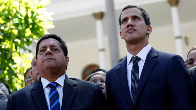 FILE PHOTO: Juan Guaido (R), new President of the National Assembly and lawmaker of the Venezuelan opposition party Popular Will (Partido Voluntad Popular), and lawmaker Edgar Zambrano of Democratic Action party (Accion Democratica), leave the congress after Guaido's swearing-in ceremony, in Caracas, Venezuela January 5, 2019. REUTERS/Manaure Quintero/File Photo VENEZUELA-POLITICS/COURT