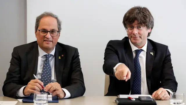 El presidente de la Generalitat de Cataluña, Quim Torra, y el expresidente Carles Puigdemont.