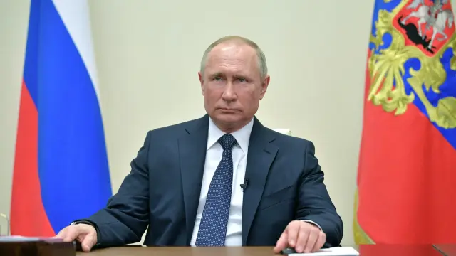 Russian President Putin delivers a televised address to the nation about the coronavirus disease outbreak, outside Moscow