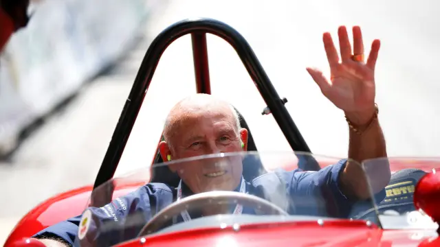 FILE PHOTO: Stirling Moss waves to spectators as he sits in his 1955 Ferrari 750 Monza during the Ennstal Classic rally in this 2013 file photo