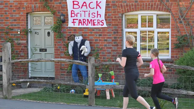 Scarecrows representing key workers lighten the daily lockdown walk, as the number of the coronavirus disease cases (COVID-19) grows around the world, in the village of Capel