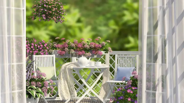 Balcony, white furniture and flowers