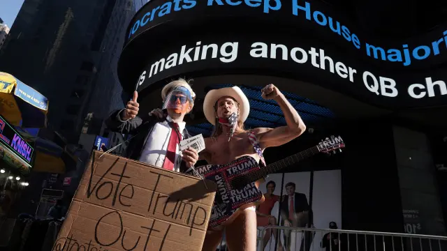 Robert Burck, better known as the "Naked Cowboy" poses for a picture in Times Square