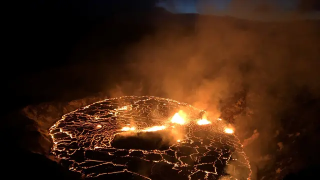 A rising lava lake is seen within Halema'uma'u crater during the eruption of Kilauea  volcano