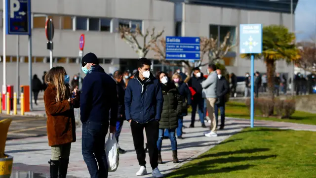 People queue to get tested for the coronavirus disease (COVID-19) after the Christmas holiday break, amid the COVID-19 pandemic, at Doce de Octubre Hospital in Madrid