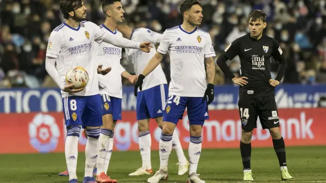 Eugeni, Sabin Merino y Lluís López, durante el partido contra el Málaga.