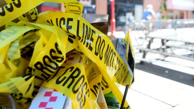 Ploce tape is trashed at the scene of a shooting in Philadelphia