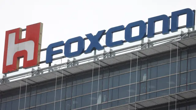 The logo of Foxconn is pictured on top of a company's building in Taipei