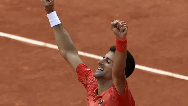 Serbia's Novak Djokovic celebrates winning the men's singles final match of the French Open tennis tournament against Norway's Casper Ruud in three sets, 7-6, (7-1), 6-3, 7-5, at the Roland Garros stadium in Paris, Sunday, June 11, 2023. Djokovic won his record 23rd Grand Slam singles title, breaking a tie with Rafael Nadal for the most by a man. (AP Photo/Aurelien Morissard)