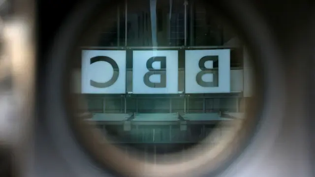 FILE PHOTO: A BBC logo is reflected in the viewfinder of a television camera outside the British Broadcasting Corporation (BBC) headquarters in London, Britain, March 13, 2023. REUTERS/Henry Nicholls/File Photo