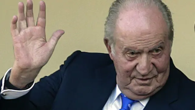 FILE - In this file photo dated June 2, 2019, Spain's former King Juan Carlos waves at the bullring in Aranjuez, Spain. Former Spanish King Juan Carlos I has won his London court battle with an ex-lover who sought $153 million in damages for allegedly being harassed and spied after their breakup. Danish socialite and businessperson Corinna Larsen, also known as Corinna zu Sayn-Wittgenstein said the former monarch caused her “great mental pain” by orchestrating threats and ordering unlawful covert and overt surveillance of her. A London judge tossed out her case and ruled that British courts don't have jurisdiction over the case because Larsen hadn't proved the harassment occurred in England and the king doesn't live there. (AP Photo/Andrea Comas, FILE)