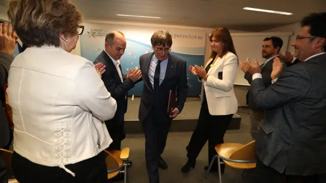 El secretario general de Junts per Catalunya, Jordi Turull, el expresidente de la Generalitat y eurodiputado de Junts, Carles Puigdemont, y la presidenta de Junts, Laura Borràs