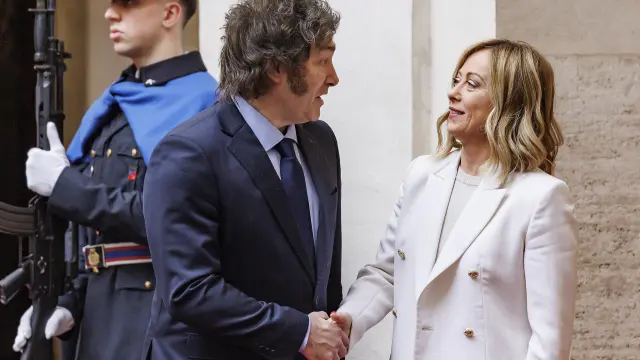 Italy's Premier Giorgia Meloni, right, welcomes Argentina's President Javier Milei as he arrives at Chigi government offices in Rome, Monday, Feb. 12, 2024. (Roberto Monaldo/LaPresse via AP)