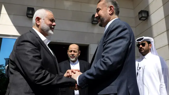 Doha (Qatar), 13/02/2024.- A handout picture made available by the Iranian foreign ministry shows Iranian Foreign Minister Hossein Amir-Abdoulahian (R) meeting Hamas leader Ismail Haniyeh in Doha, Qatar, 13 February 2024. (Catar) EFE/EPA/HANDOUT HANDOUT HANDOUT EDITORIAL USE ONLY/NO SALES HANDOUT EDITORIAL USE ONLY/NO SALES