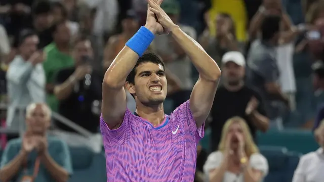 Carlos Alcaraz of Spain celebrates after defeating Lorenzo Musetti of Italy during the Miami Open tennis tournament, Tuesday, March 26, 2024, in Miami Gardens, Fla. (AP Photo/Marta Lavandier)