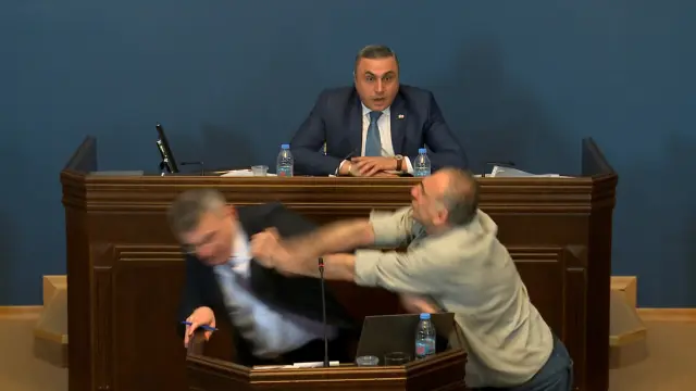 Mamuka Mdinaradze, leader of the ruling Georgian Dream partys parliamentary faction, is punched in the face by opposition MP Aleko Elisashvili during discussion of the bill on foreign agents in the Parliament, Tbilisi, Georgia, April 15, 2024 in this still image taken from a live broadcast video. Parliament of Georgia/Handout via REUTERS ATTENTION EDITORS - THIS IMAGE WAS PROVIDED BY A THIRD PARTY. NO RESALES. NO ARCHIVES. MANDATORY CREDIT [[[REUTERS VOCENTO]]]
