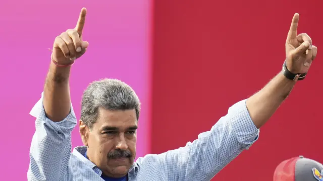 President Nicolas Maduro waves to supporters during his closing election campaign rally in Caracas, Venezuela, Thursday, July 25, 2024. Maduro is seeking re-election for a third term in the July 28 vote. (AP Photo/Fernando Vergara)