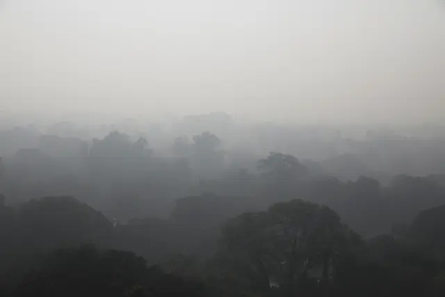 Buildings are seen shrouded in smog in New Delhi