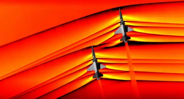 La imagen muestra el choque supersónico, captado usando la técnica de fotografía schlieren o estrioscopía, un proceso óptico usado para fotografiar la variación de densidad de un fluido. Es una de las primeras imágenes de la interacción de las ondas de choque de dos aviones supersónicos que volaban en formación.