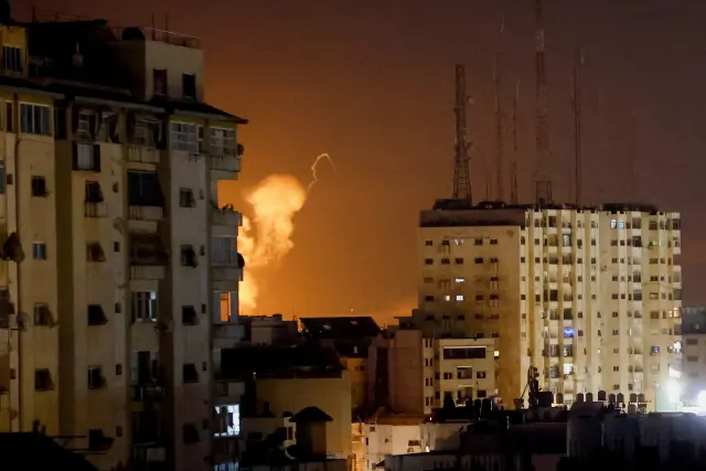 Smoke rises amid buildings during Israeli airstrikes in Gaza