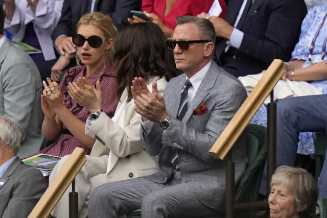 Actor Daniel Craig and his wife, actor Rachel Weisz and actor Imogen Poots, left, sit in the Royal Box on Centre Court for the final of the men's singles between Spain's Carlos Alcaraz and Serbia's Novak Djokovic on day fourteen of the Wimbledon tennis championships in London, Sunday, July 16, 2023. (AP Photo/Alastair Grant)