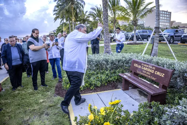 Miami (United States), 14/07/2023.- National Shrine of Our Lady of Charity'Äôs Rector Rev. Father Jose J. Espino, blesses the new bench dedicated to the Cuban singer Celia Cruz at the National Shrine of Our Lady of Charity as part of the 20th anniversary commemoration of her death, in Miami, Florida, USA, 14 July 2023. EFE/EPA/CRISTOBAL HERRERA-ULASHKEVICH
