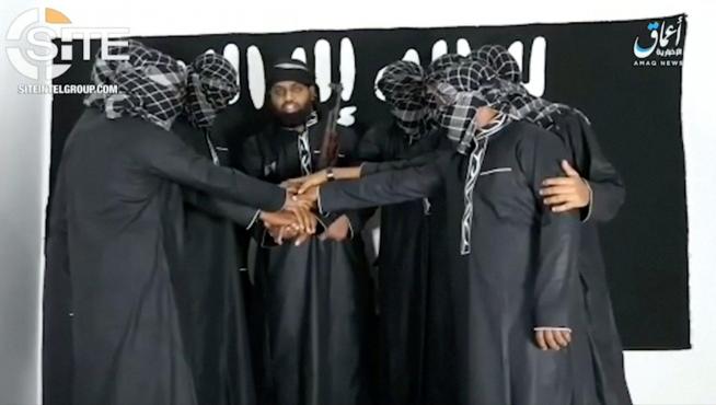 A group of men purported to be the the Sri Lanka bomb attackers is seen at an unknown location in this still image taken from video uploaded by the Islamic State's AMAQ news agency April 23, 2019 and received by Reuters via SITE Intel Group. Video uploaded April 23, 2019.  AMAQ via SITE INTEL GROUP/Handout via REUTERS TV    ATTENTION EDITORS - THIS IMAGE HAS BEEN SUPPLIED BY A THIRD PARTY. NO RESALES. NO ARCHIVES      TPX IMAGES OF THE DAY [[[REUTERS VOCENTO]]] SRI LANKA-BLASTS/
