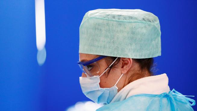 A nurse in a protective suit is pictured at a drive-in testing site for coronavirus in Liege