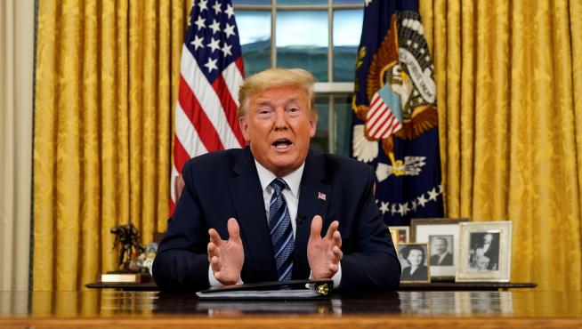 U.S. President Trump speaks about the U.S response to the COVID-19 coronavirus pandemic during an address to the nation from the Oval Office of the White House