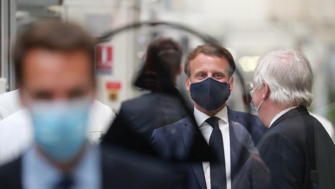 French President Emmanuel Macron visits a factory of automotive manufacturer Valeo in Etaples