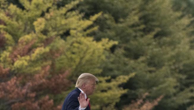 US President Donald Trump, returns to the White House