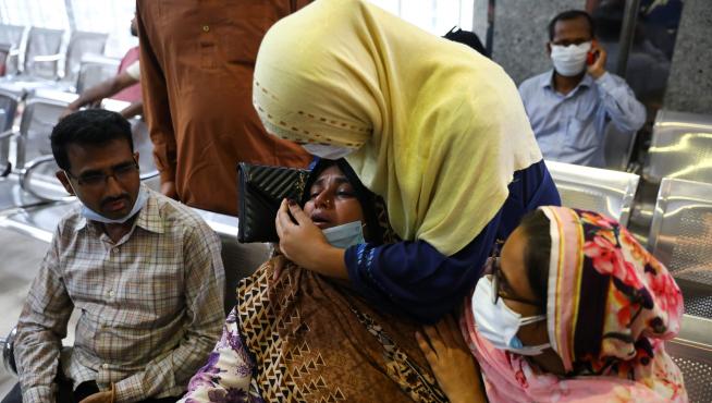 Relatives of victims mourn at a hospital, after a gas pipeline blast at a mosque in Narayanganj