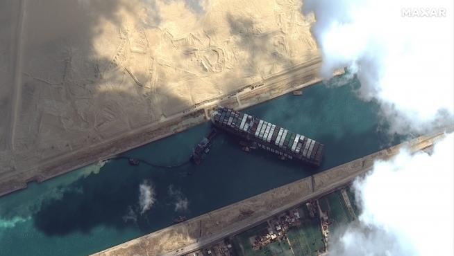 Ever Given container ship is pictured in Suez Canal in this Maxar Technologies satellite image taken on March 26, 2021. Maxar Technologies/Handout via REUTERS ATTENTION EDITORS - THIS IMAGE HAS BEEN SUPPLIED BY A THIRD PARTY. MANDATORY CREDIT. NO RESALES. NO ARCHIVES. DO NOT OBSCURE LOGO.?[[[REUTERS VOCENTO]]] EGYPT-SUEZCANAL/SHIP