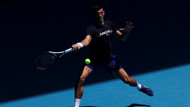Serbian tennis player Novak Djokovic practices at Melbourne Park as questions remain over the legal battle regarding his visa to play in the Australian Open