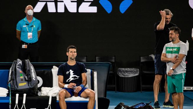 Serbian tennis player Novak Djokovic rests during a training session at Melbourne Park