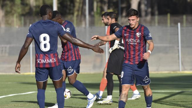 Soko y Escriche, durante el amistoso de la SD Huesca con el Andorra.