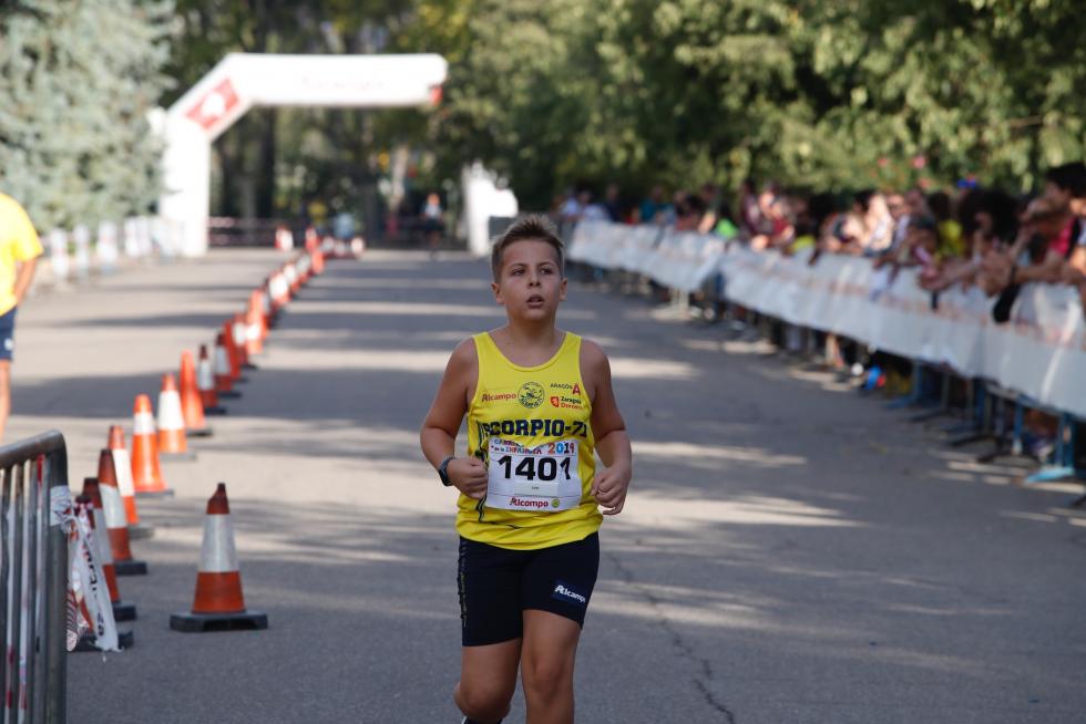 La Carrera de la Infancia de Zaragoza ha celebrado este domingo su decimocuarta edición con la participación de más de 1.100 niños en el Parque José Antonio Labordeta.