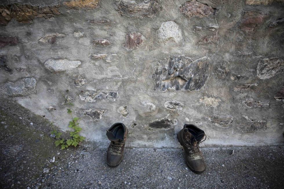 Botas secándose en una calle de San Juan de Plan